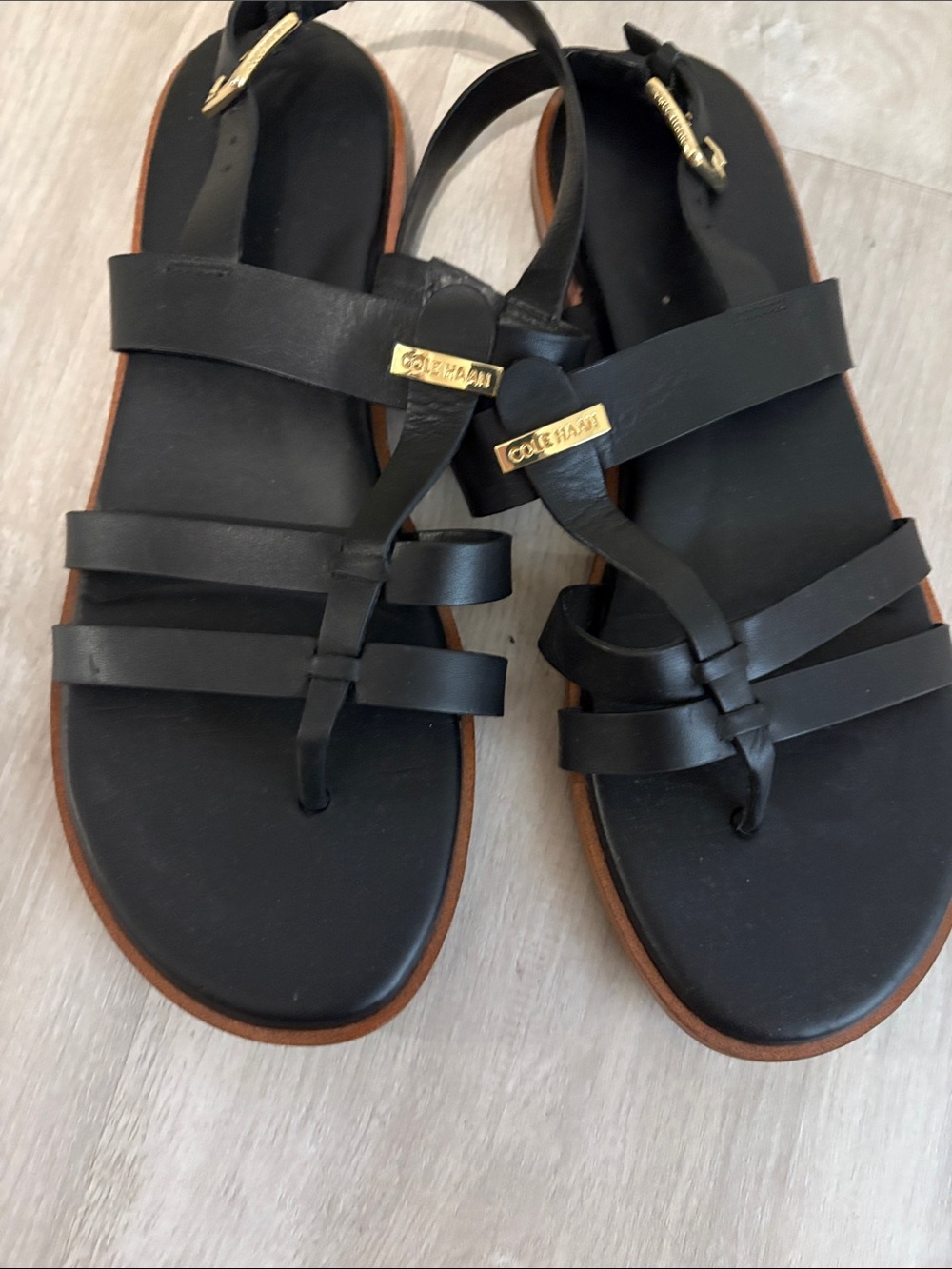 Cole Haan Black Leather Strappy Toe-Loop Sandals with Gold Accents